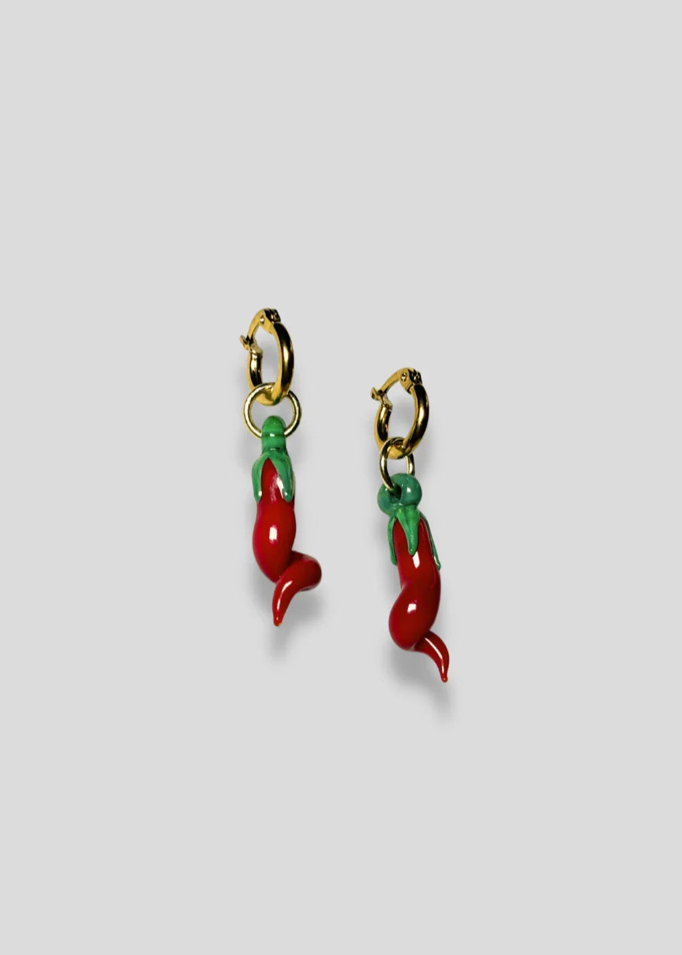 A pair of handcrafted glass chilli earrings with gold vermeil hooks, crafted in an Australian studio.